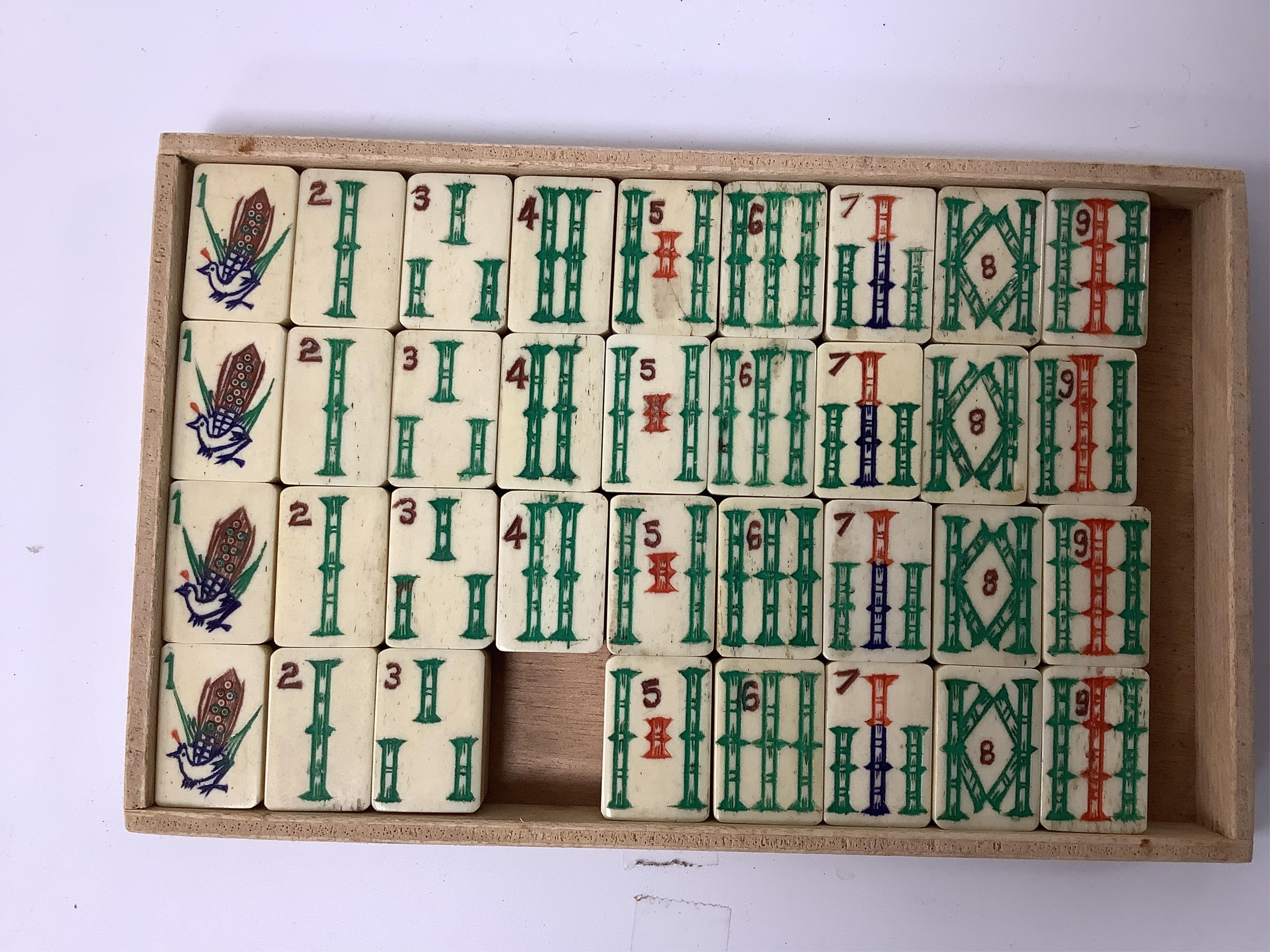 A Chinese bone mahjong set, cased, 23cm wide. Condition - fair